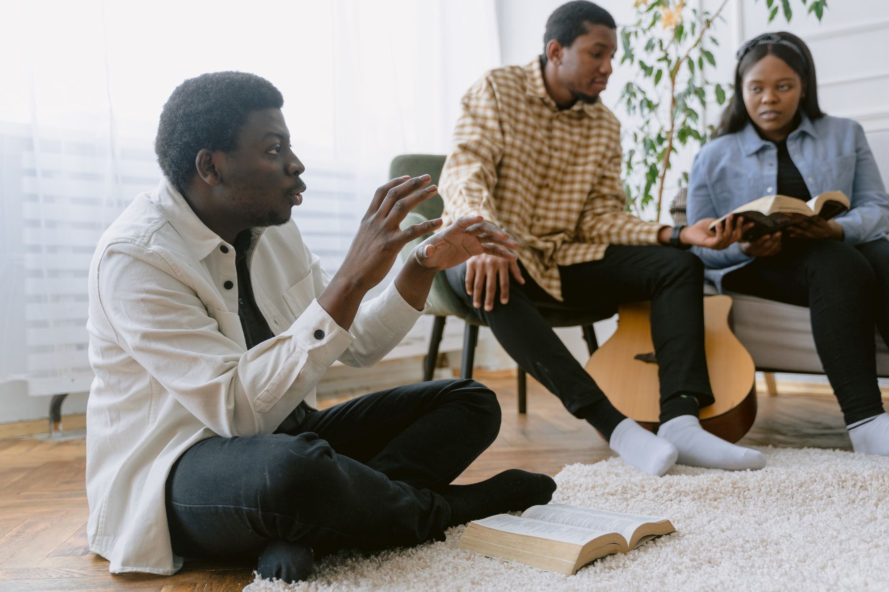 A group talking with open Bibles